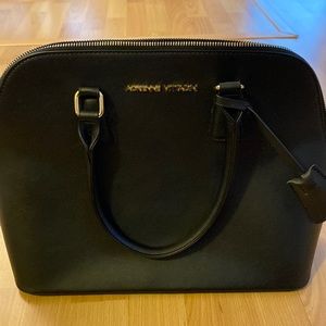 Adrienne Vittadini black bag, in pristine condition, with gold colored zip
